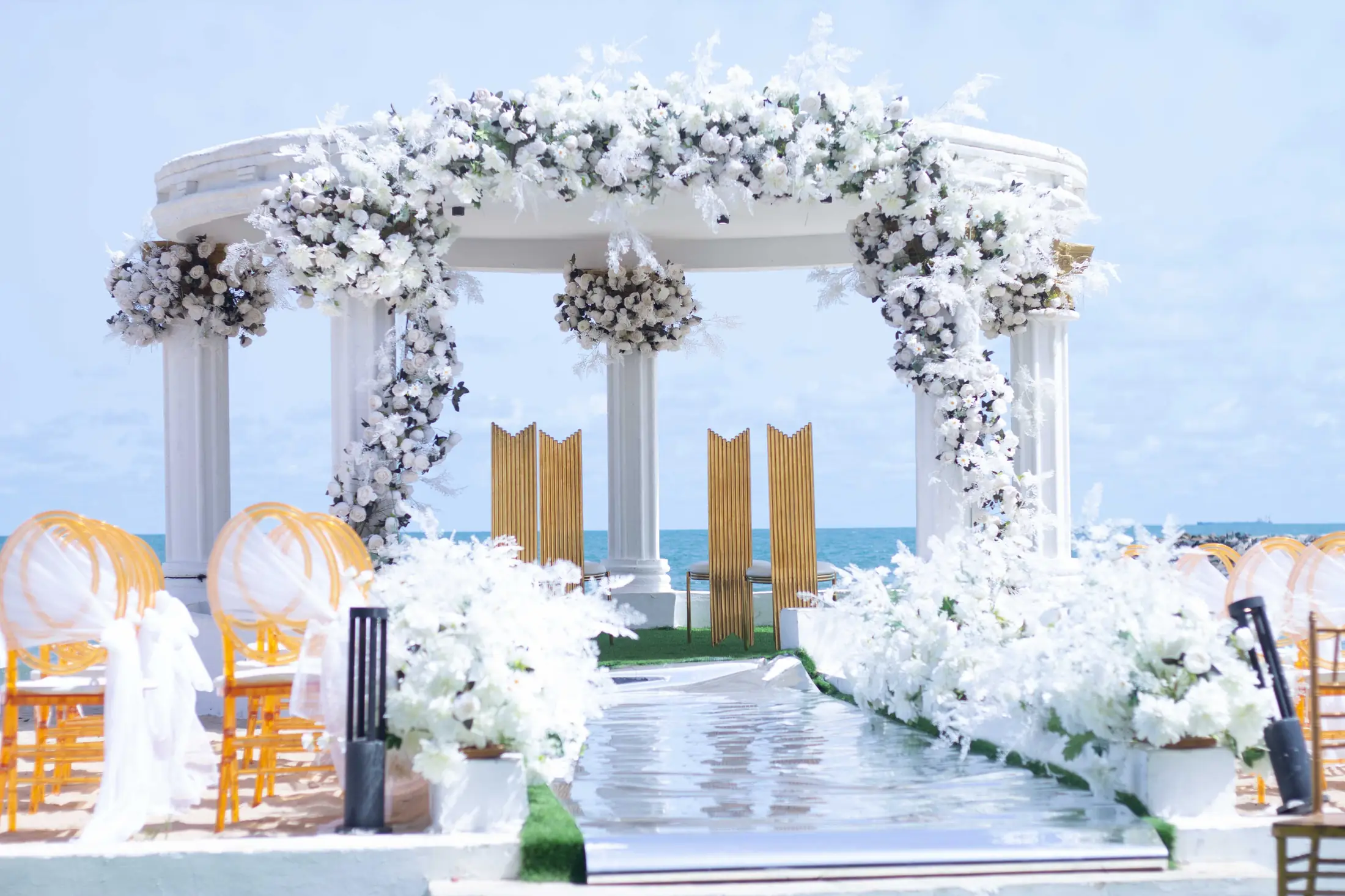 White flowers along the aisle to the gazebo