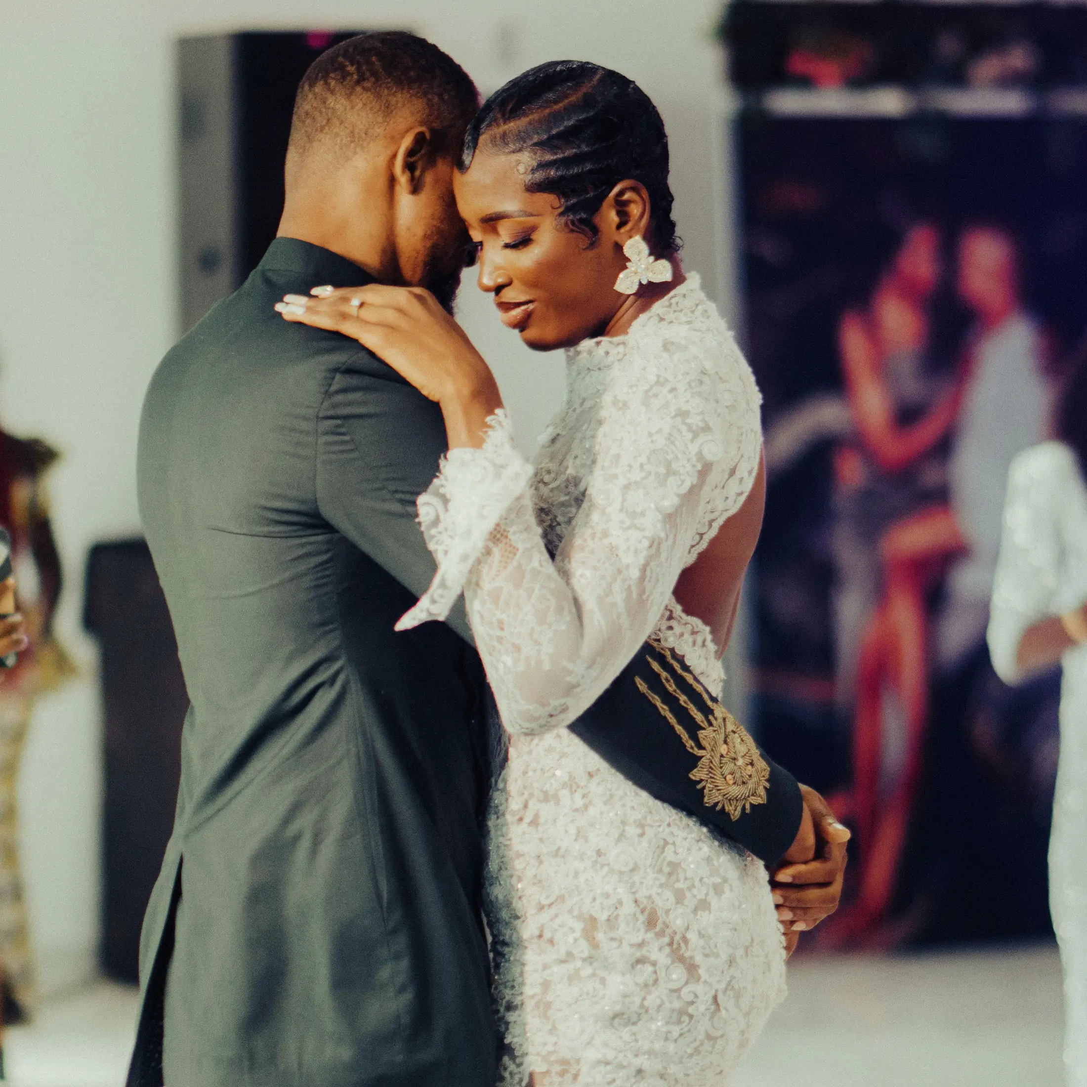 A couple holding each other close in their first dance