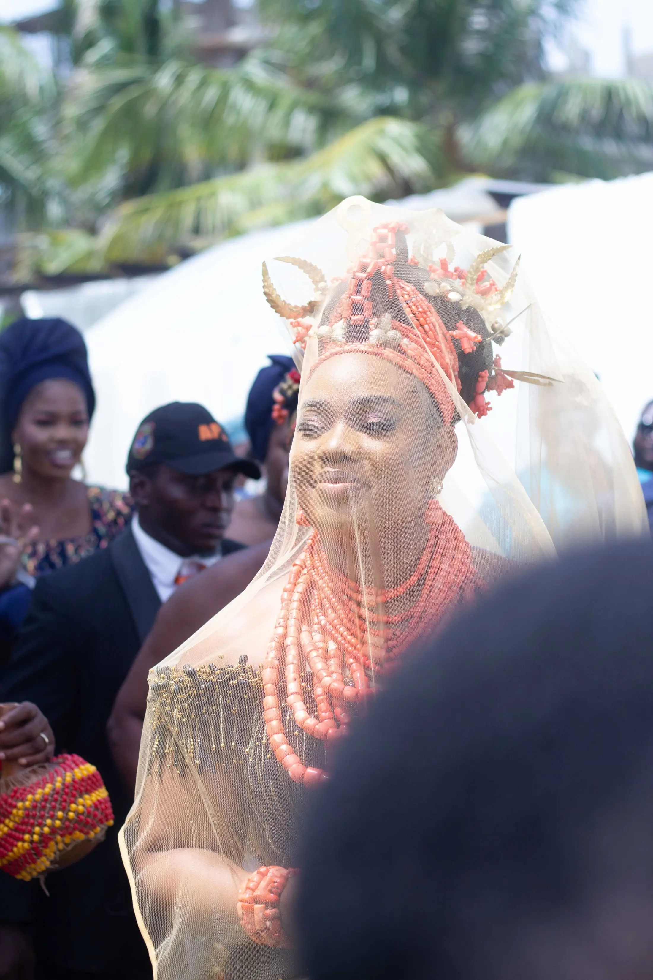 A traditional bride smiling among her guests