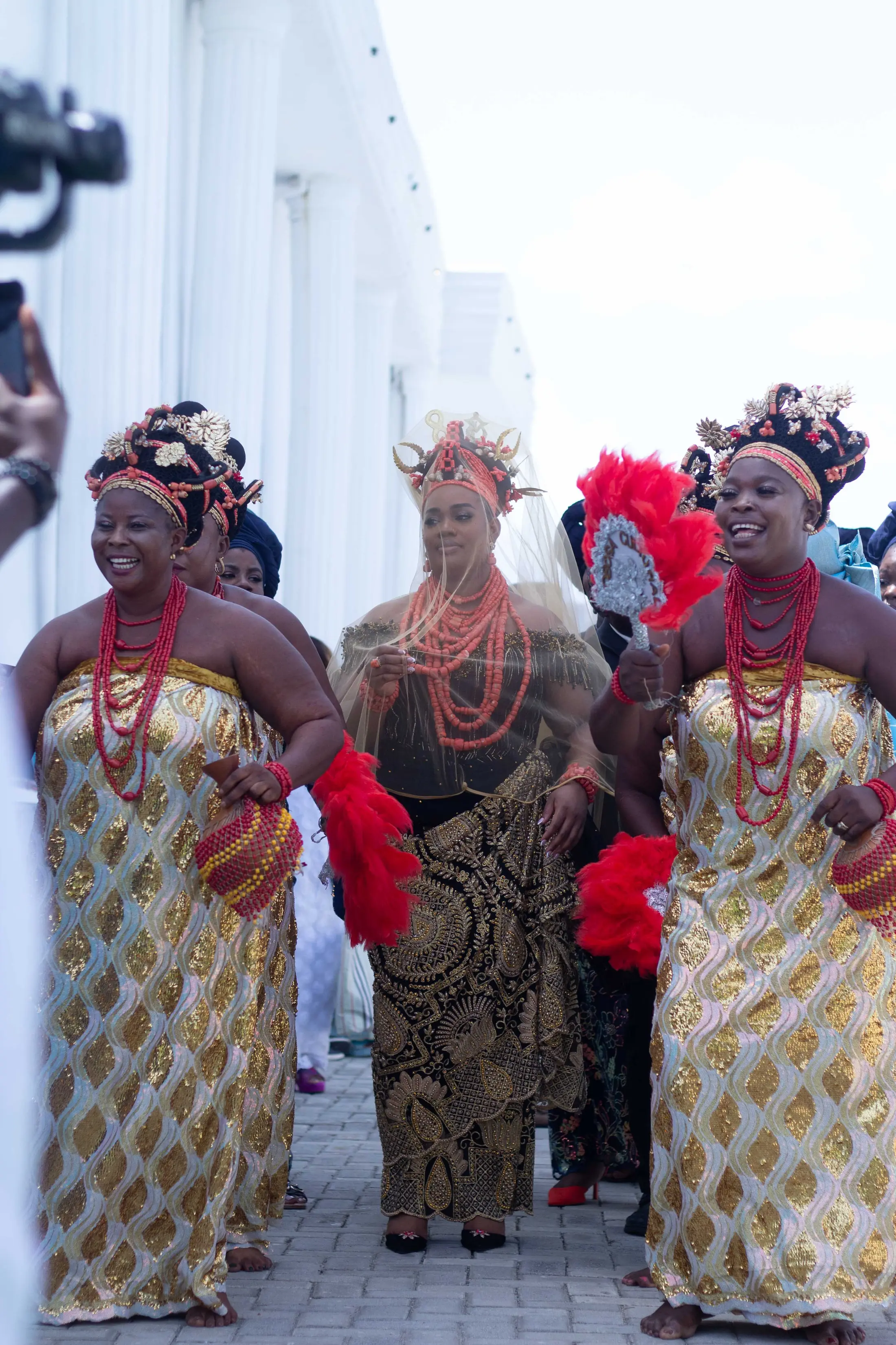 The family dancing in to the traditional ceremony