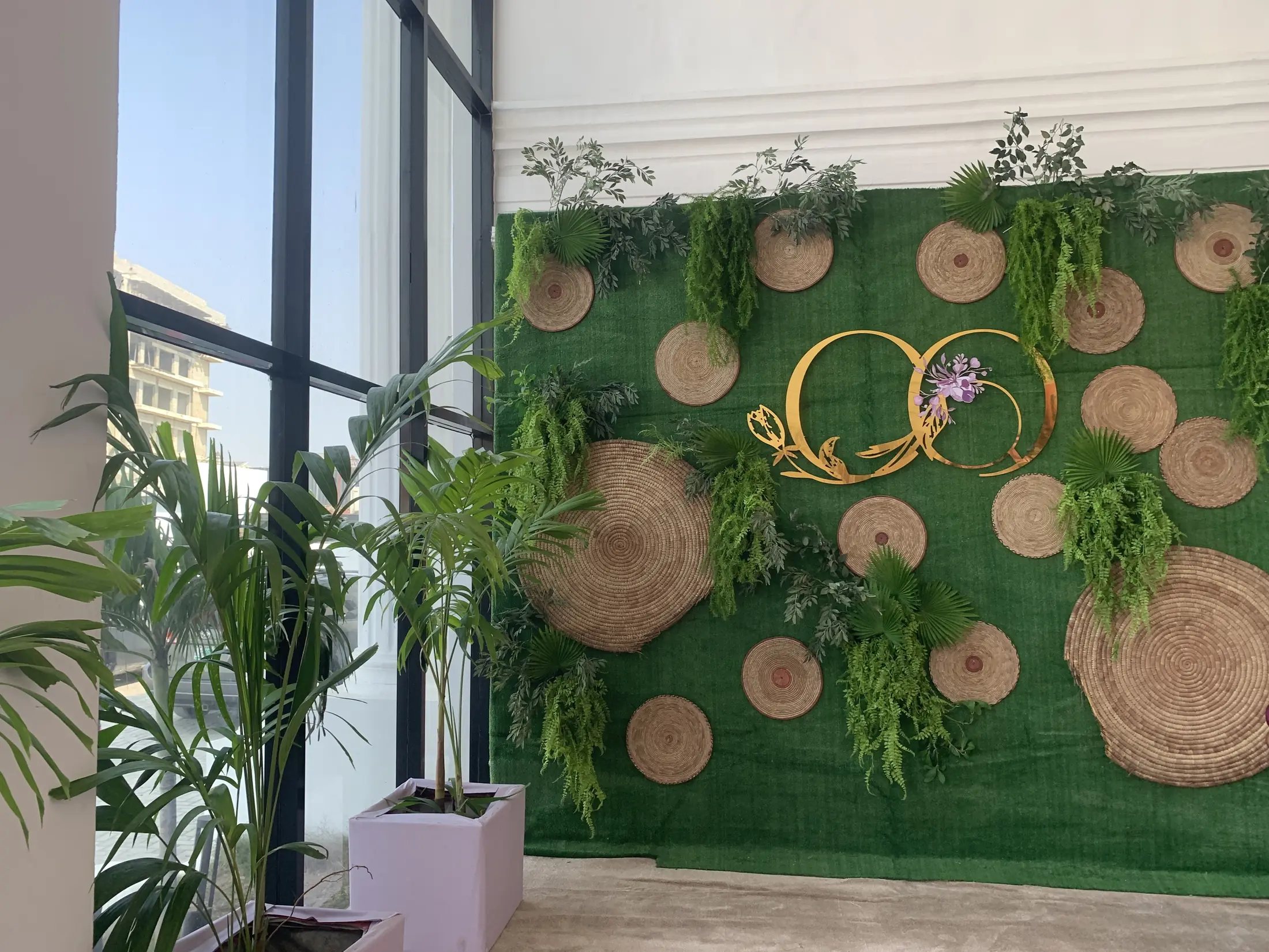 A flower-and-greenery backdrop in the hall