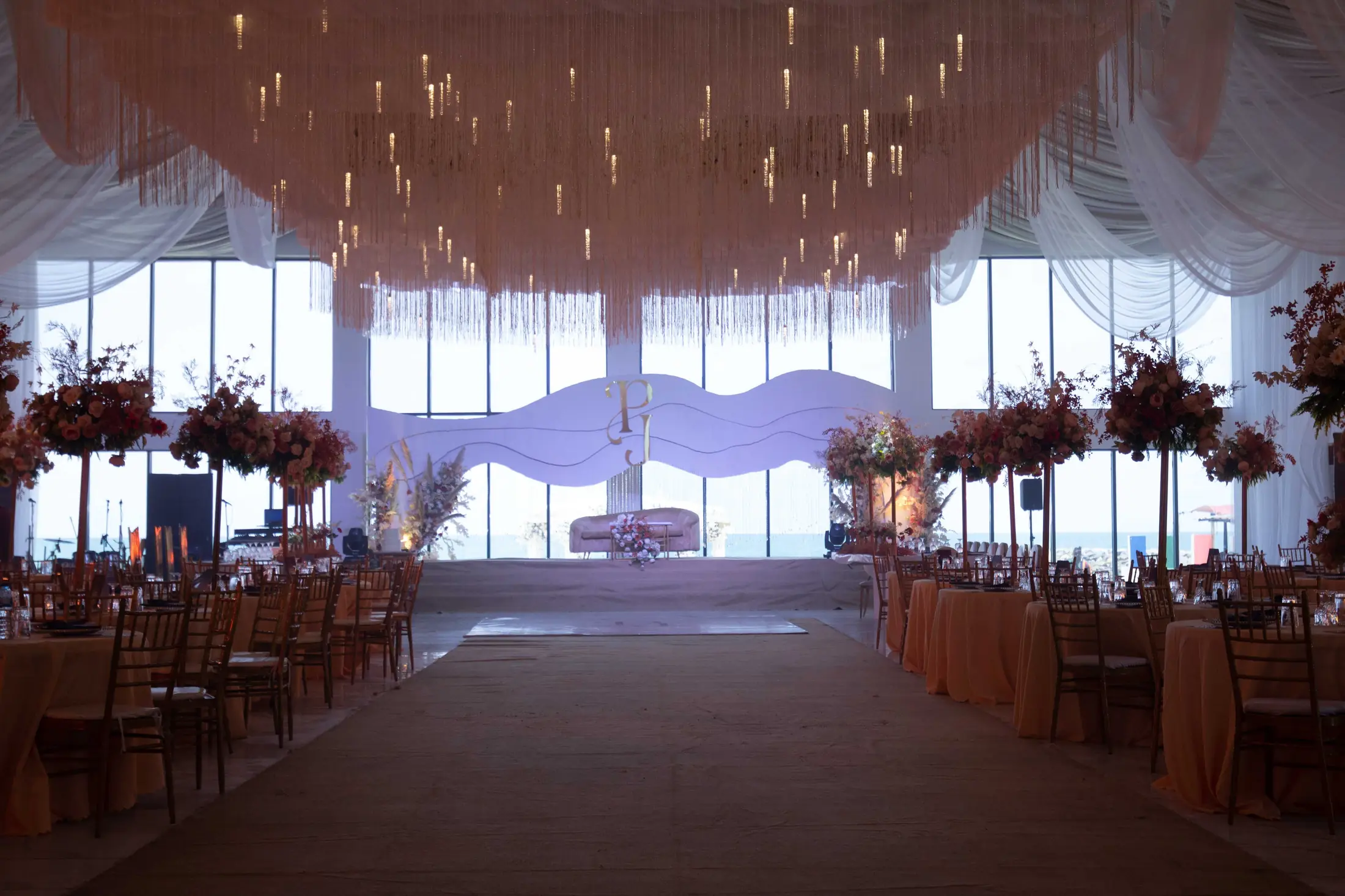 Reception tables through the hall to the glass wall