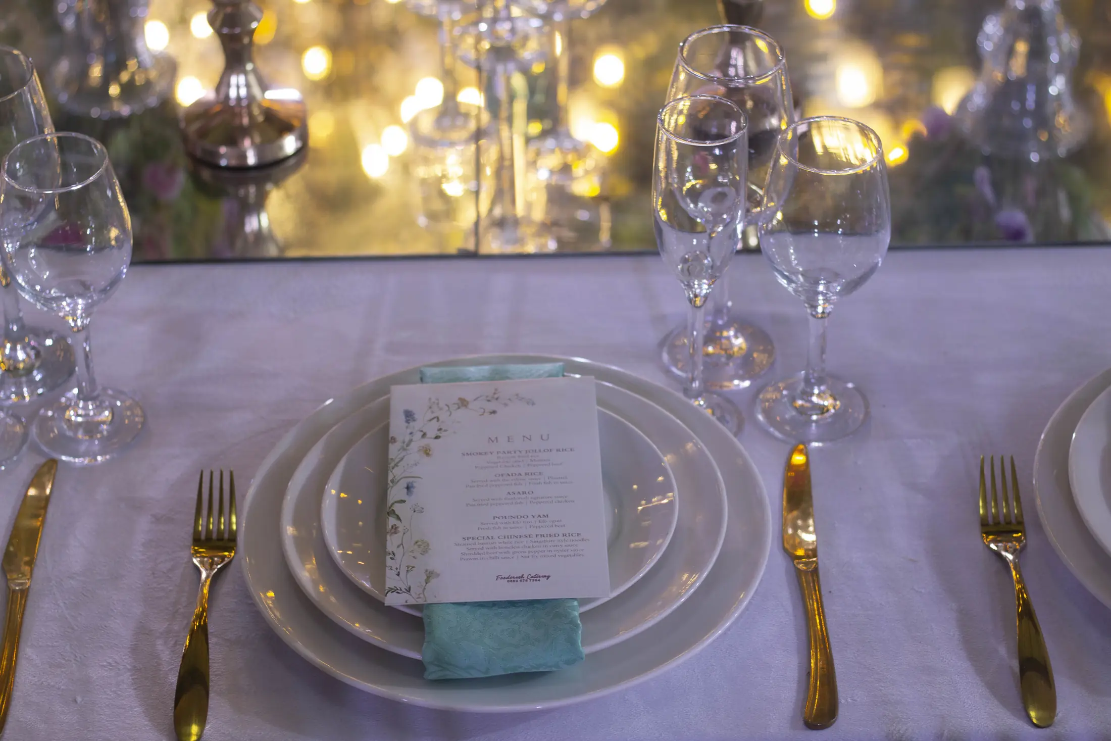 A place setting in white and gold