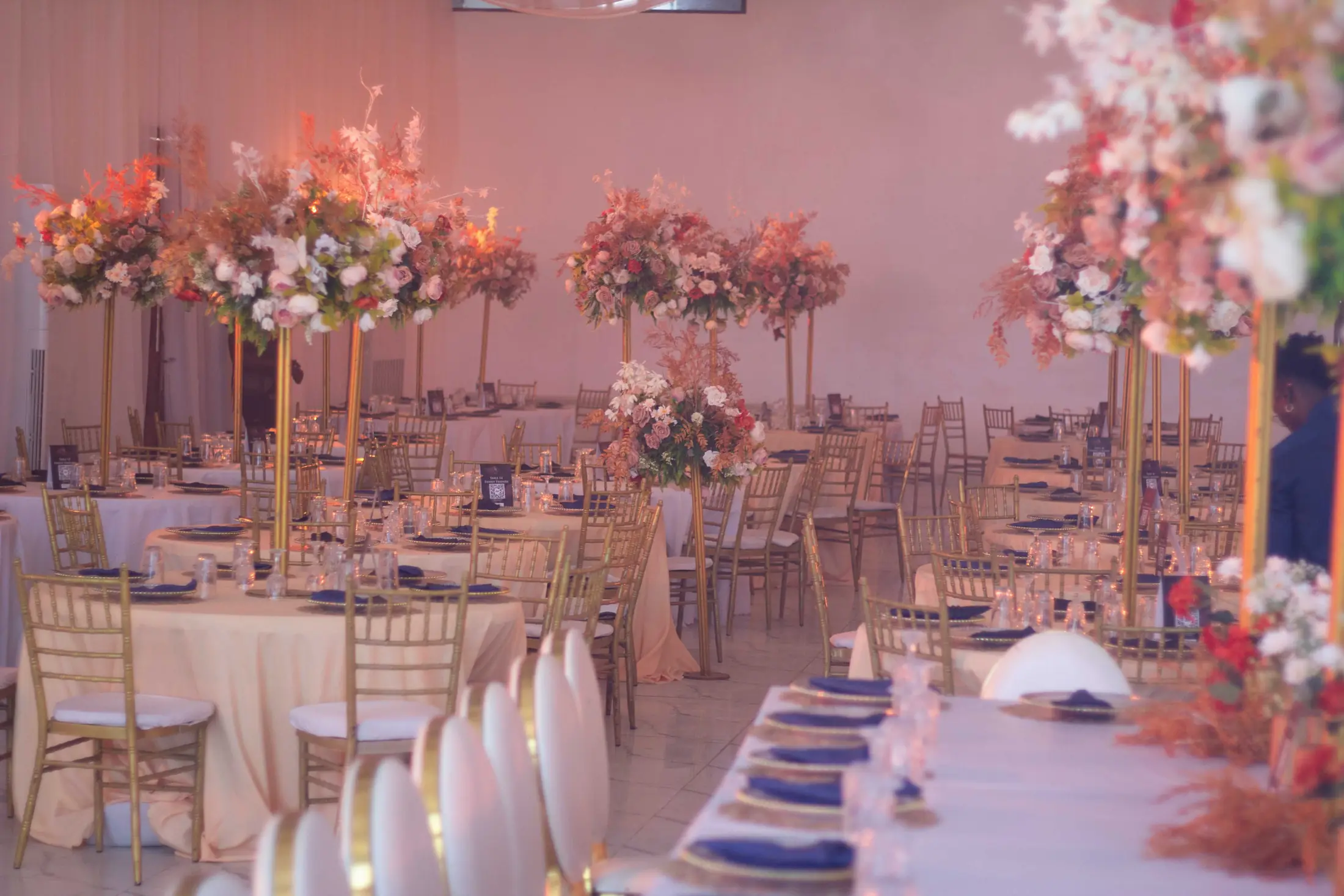 A reception table set in pink and gold